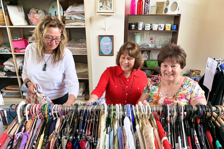 Women looking at clothes on a clothesrack