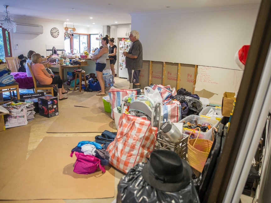 Burringbar resident Alastair Gibb with family inside his home