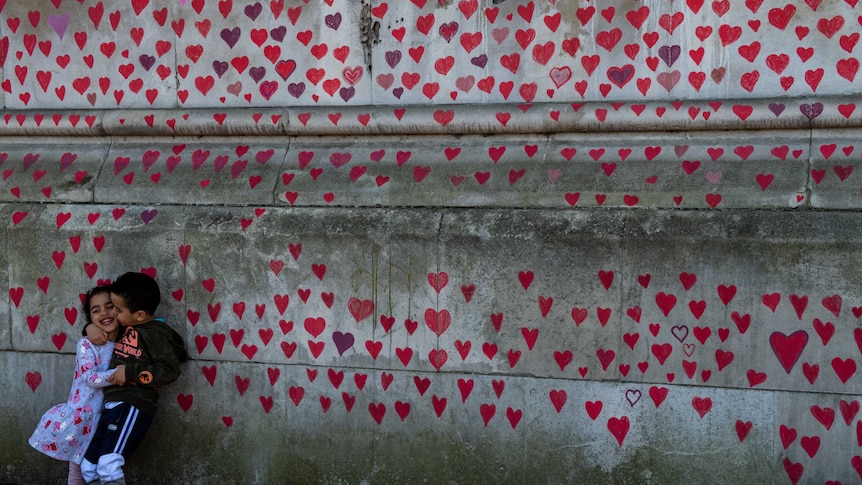 A wall of painted, red hearts on the COVID19 Memorial Wall in London