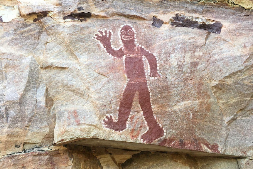 A red figure painted on a rock north of Wyndham in WA's Kimberley.