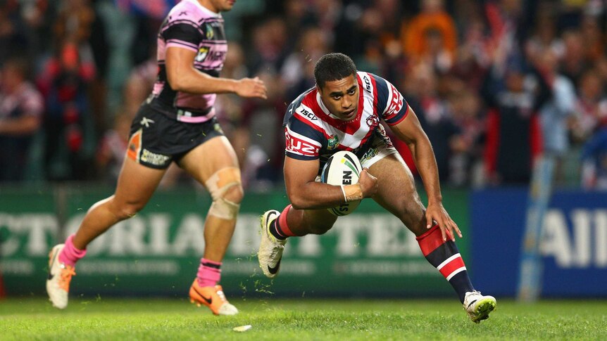 Michael Jennings scores for the Roosters against Wests Tigers at the Sydney Football Stadium.