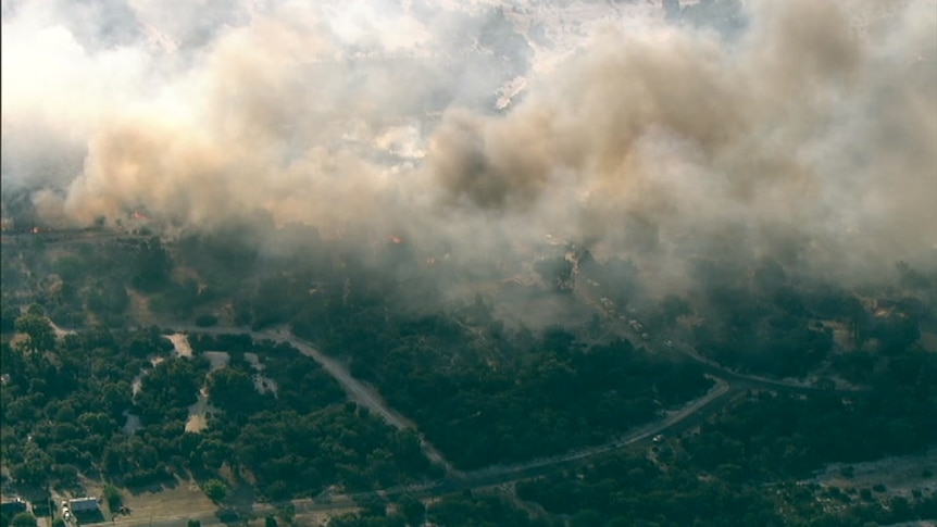 Aerial of fire in semi-rural area