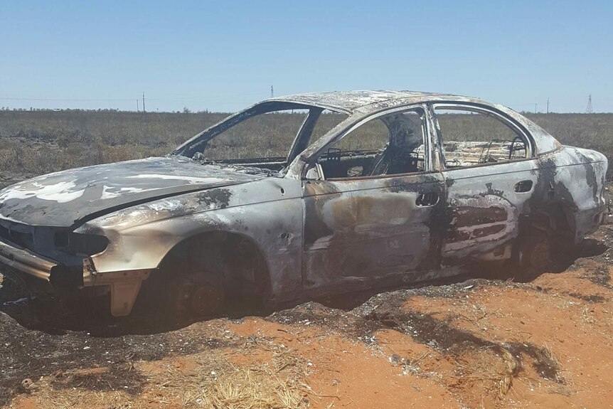 A burnt out car wreck.
