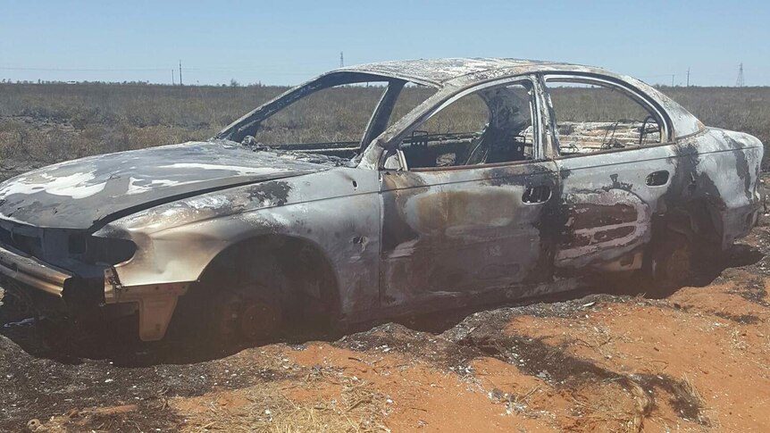 A burnt out car wreck.
