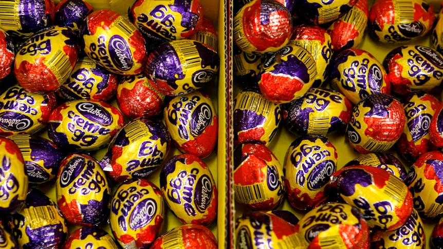 Dozens of Cadbury chocolate eggs in boxes. 