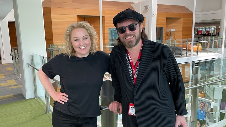 Zan and gaz Coombes wearing black and smiling at the camera at the ABC