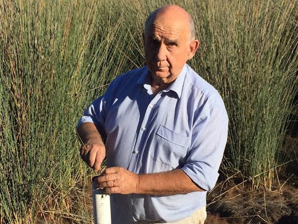 Groundwater expert Dr Philip Pells at Thirlmere Lakes testing the groundwater.