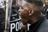 Baltimore protestor faces police during protest