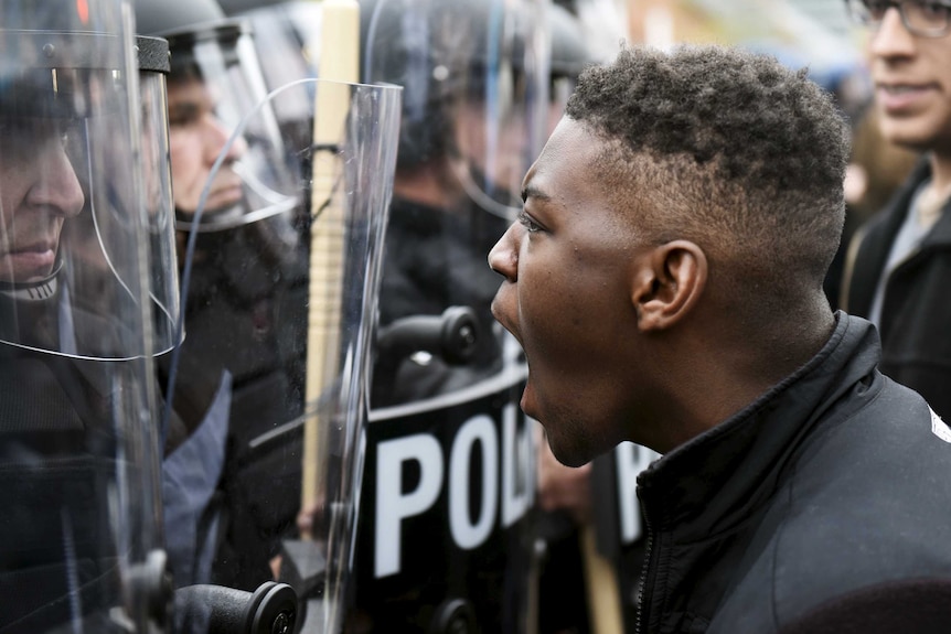 Baltimore protestor faces police during protest