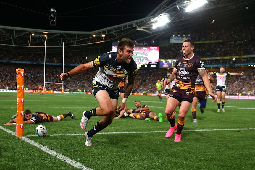 A man scores a try in a grand final 