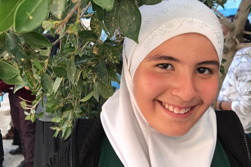 Amid conflict and danger, 12-year-old refugee Asma attends school in the hope of becoming a doctor.