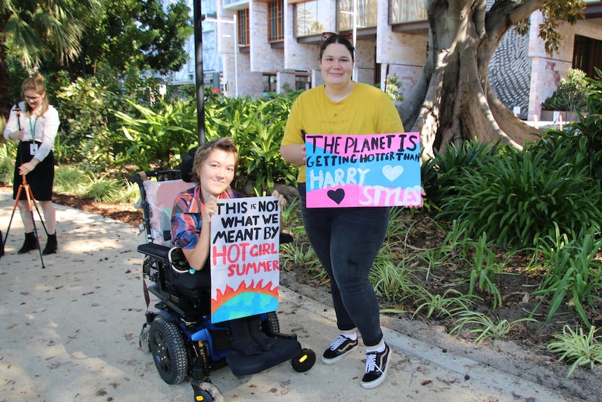 Two protesters at a climate change rally in Perth.