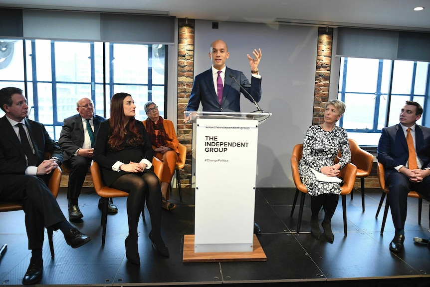 The seven Labour MPs grouped together onstage during a press conference.