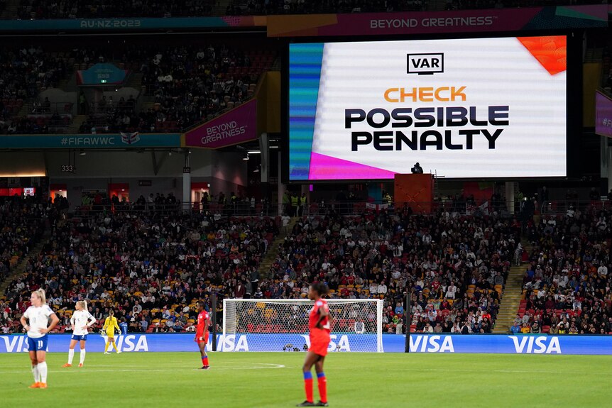 A video screen in a stadium says VAR check possible penalty 