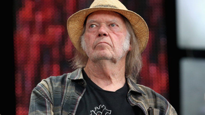 rock star neil young looks off camera