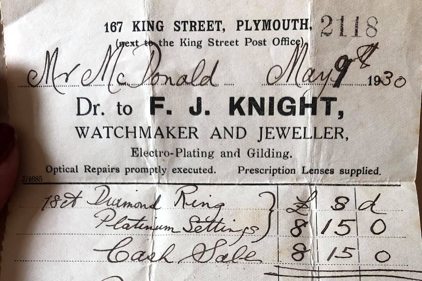 An old, crumpled receipt from F J Knight Jeweller says received with thanks the sum of 8 pounds and 15 shillings.