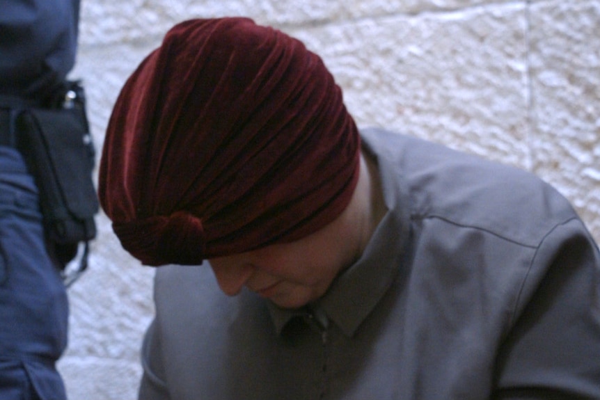 Malka Leifer looks down to her feet during the hearing.