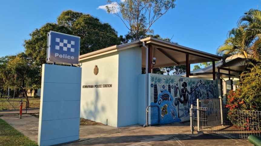 A remote police station with an Indigenous painting on the side.