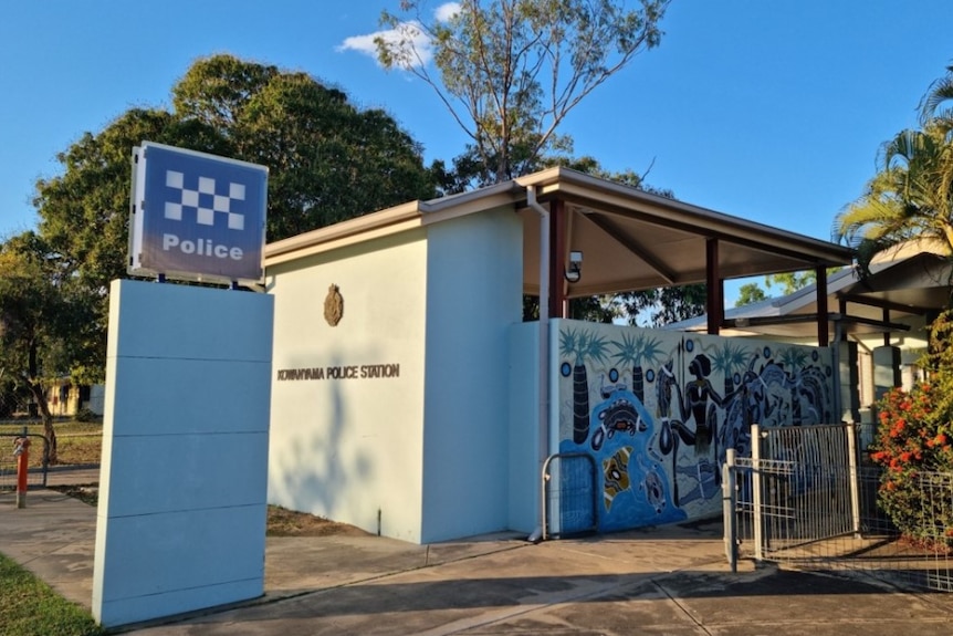 A remote police station with an Indigenous painting on the side.