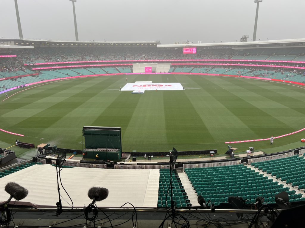 A rainy and misty cricket field seen from above