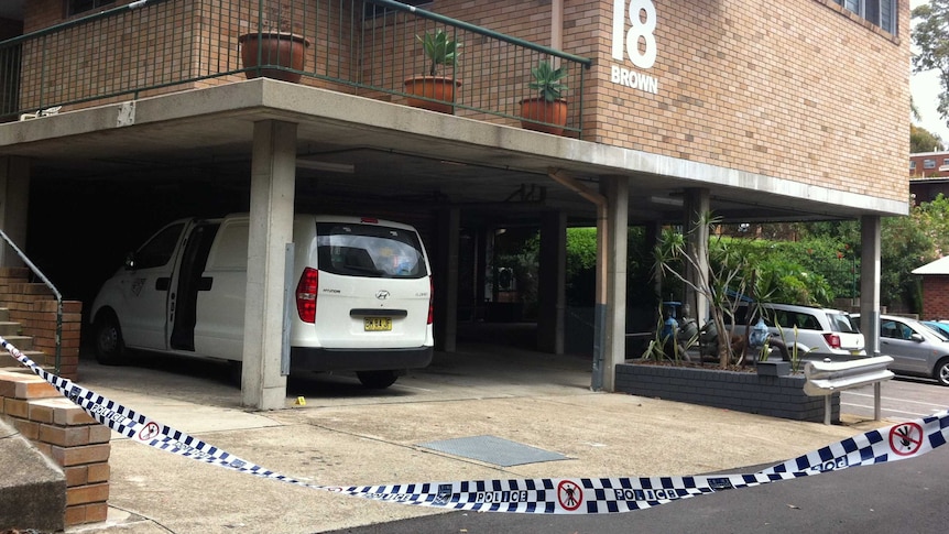 Forensic experts are examining the Newcastle unit where a woman was stabbed to death.