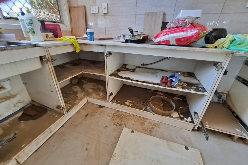 A ruined and muddy kitchen. 
