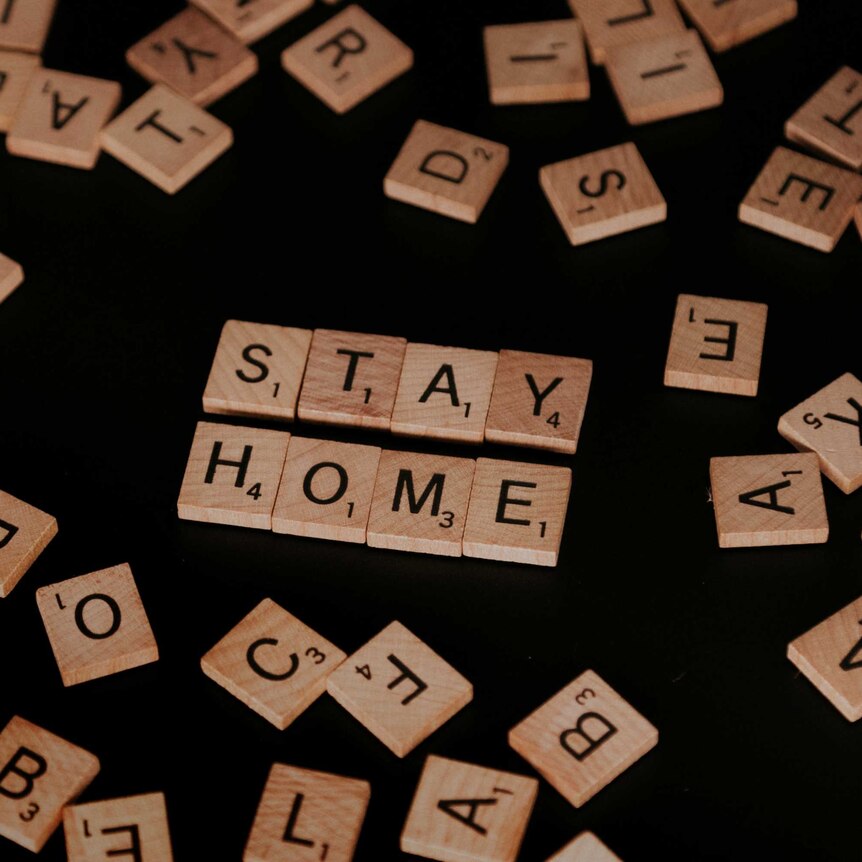 Scrabble tiles spell out Stay Home