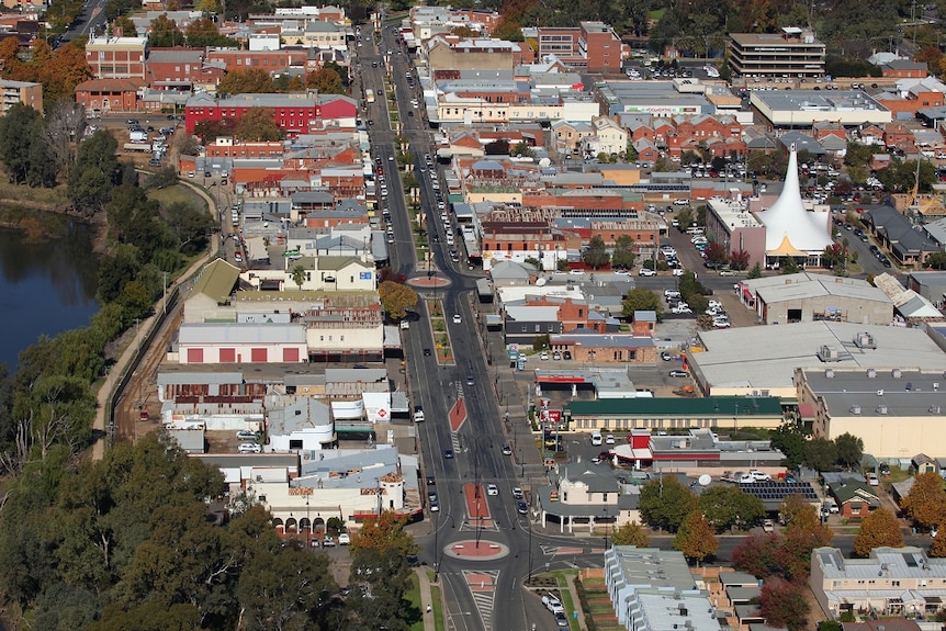 Aerial photo of a small city street with buildings either side