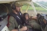 Baby chimpanzee flies high after rescue from poachers