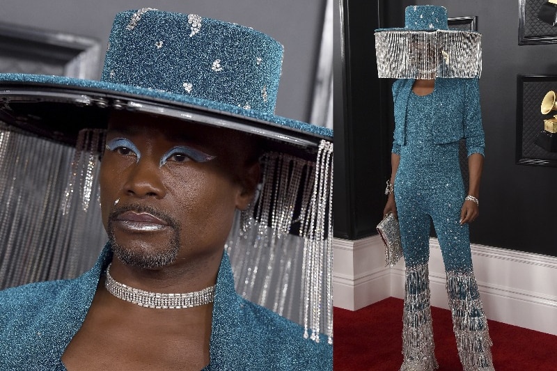 Billy Porter arrives at the Grammys wearing a blue sparkling one-piece jumpsuit and jacket with a tassled hat
