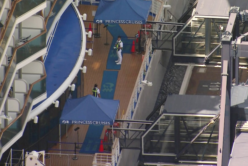 people wearing masks on a cruise ship