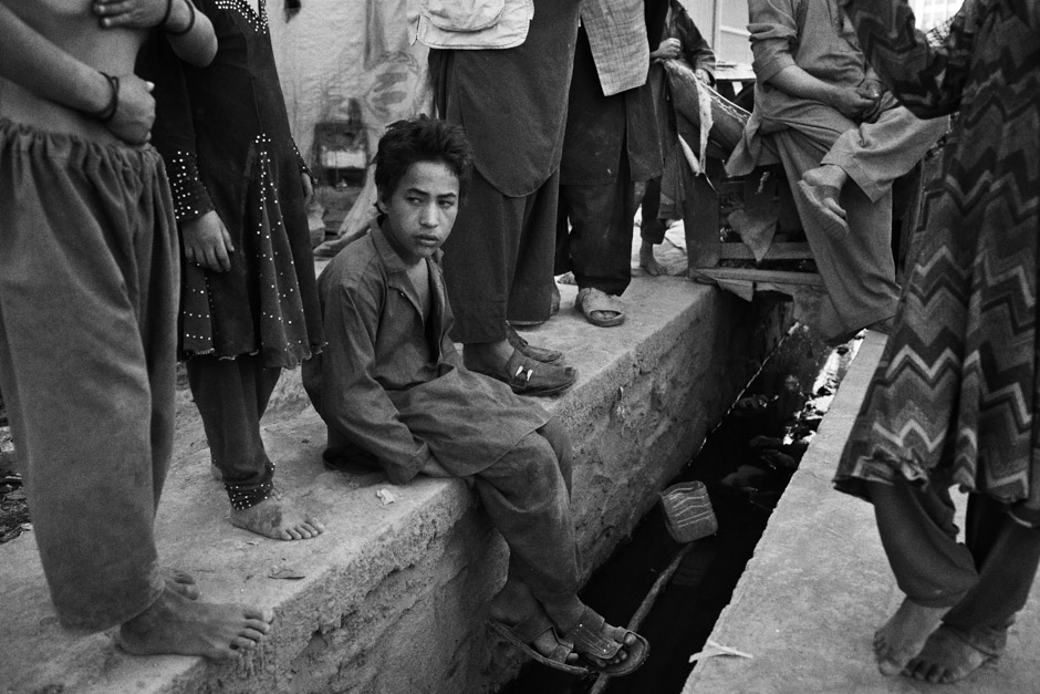 Members of a group of families that set up on a corner of vacant land by a chaotic roundabout in Kabul a decade ago.