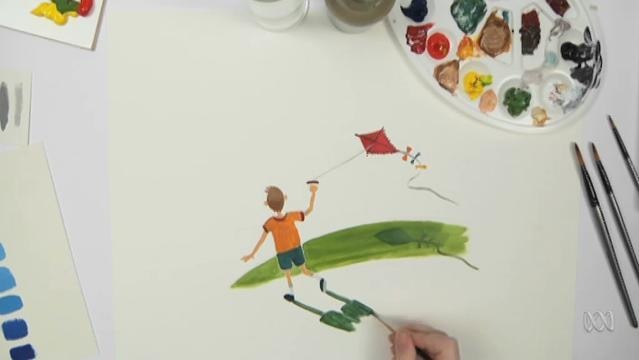 Hand paints picture of boy flying a kite
