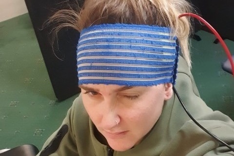 A woman with a head wrap like a head band