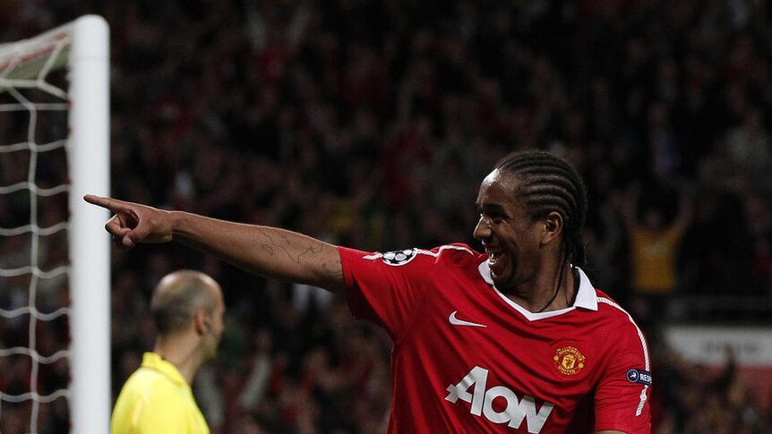 At the double... Anderson celebrates his second goal in his team's romp at Old Trafford.