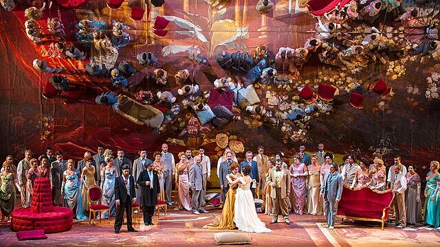 A crowded party scene from Verdi's opera La Traviata.