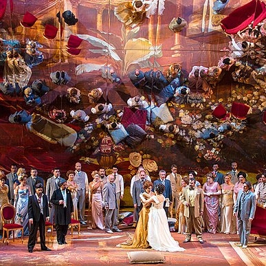 A crowded party scene from Verdi's opera La Traviata.