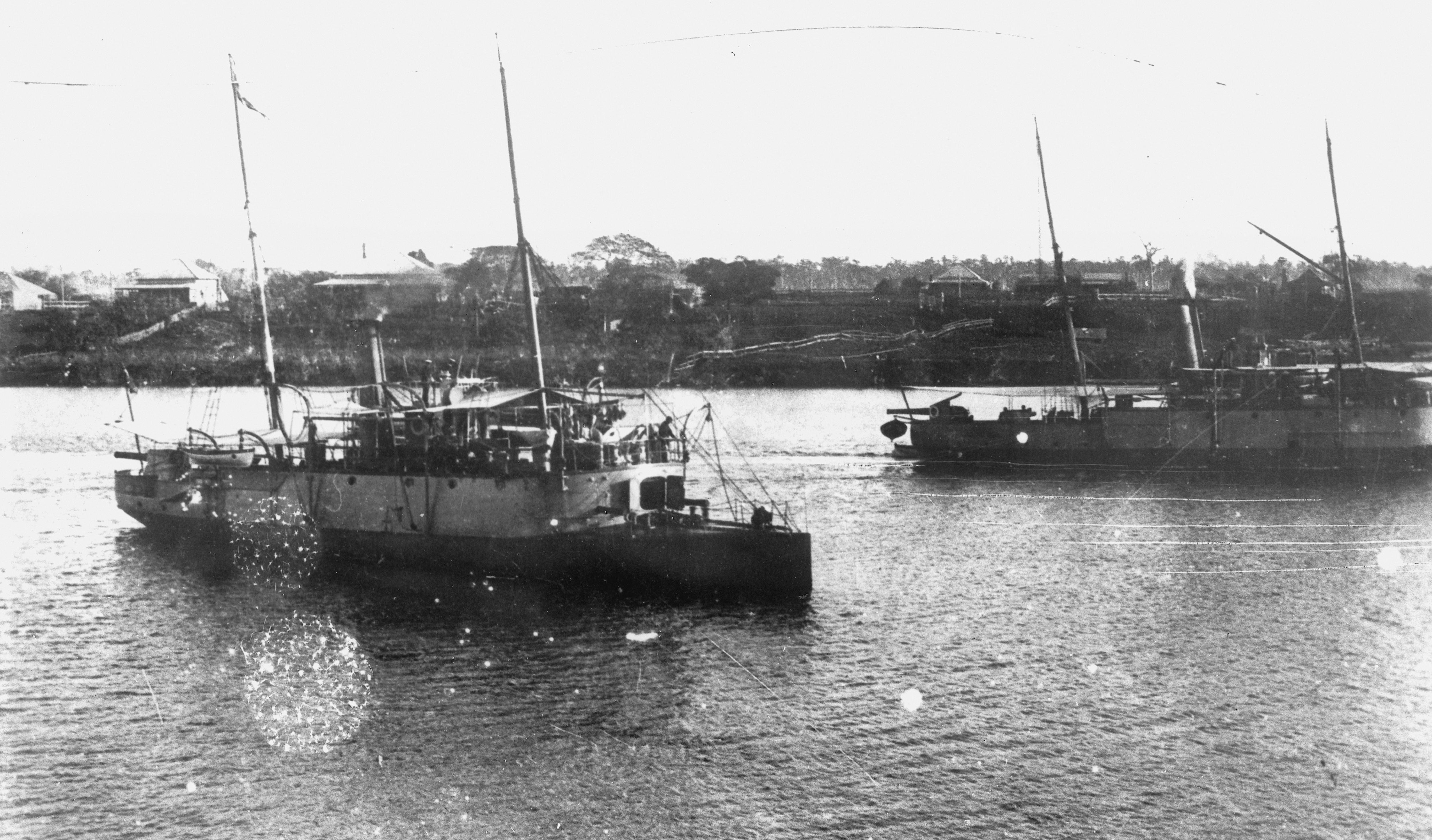 A photo from the 1800s depicting two gunboats on a regional Queensland river.