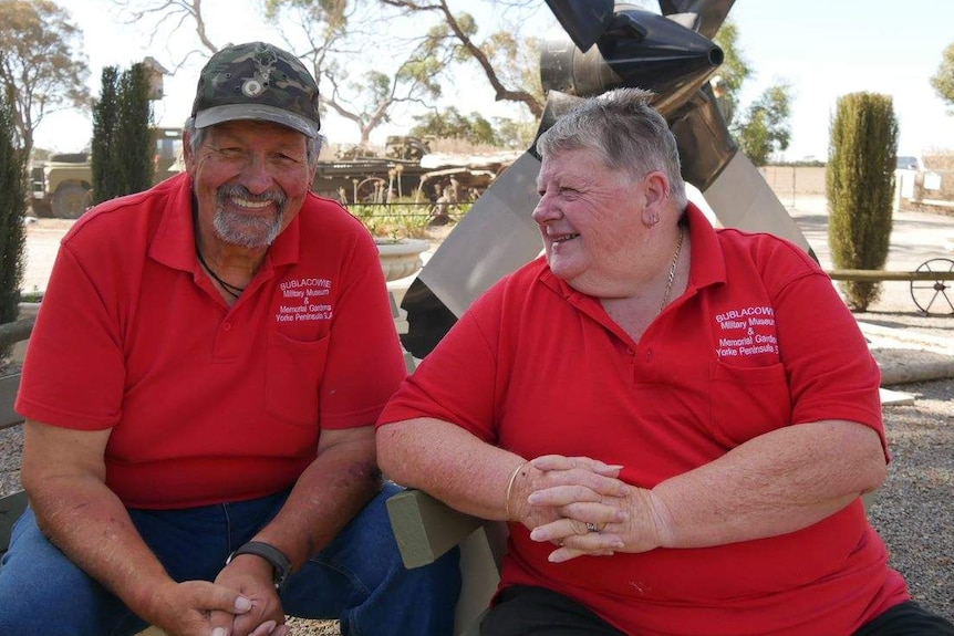 A couple of volunteers wearing T-shirts with logos for the Bublacowie Military Museum