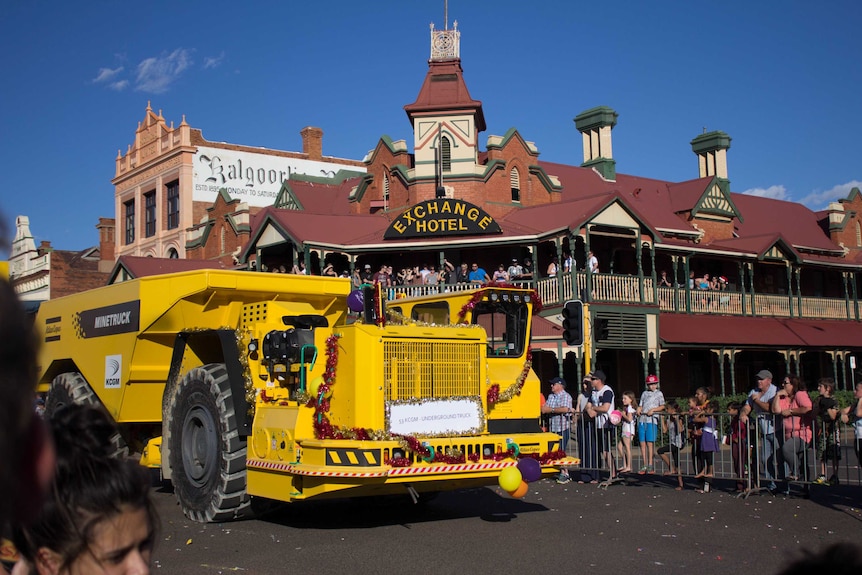 A large mining vehicle rolls down Hannan Street during the St Barbara's Parade.