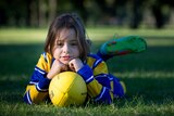 Analise Lawrance, nine, plays football for the Flemington MUGARS.