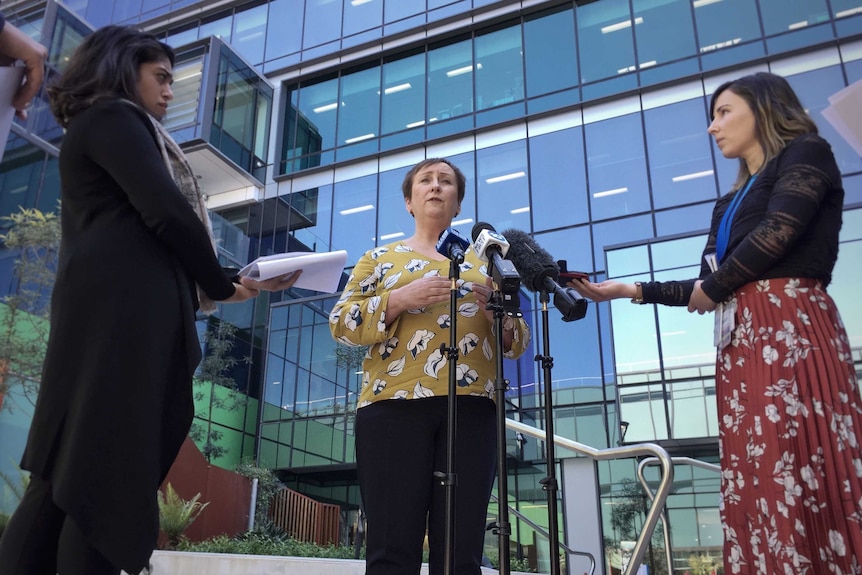 Health executive Lesley Dwyer speaks to the media outside the Royal Adelaide Hospital.