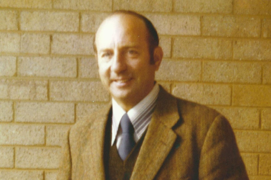 Headshot of smiling disgraced former Anglican Bishop Donald Shearman, dressed in a suit.