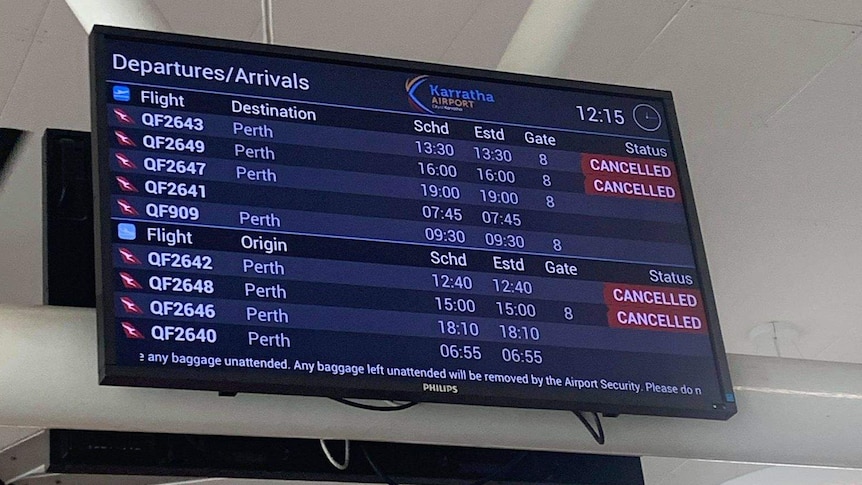 Airport sign showing flights cancelled