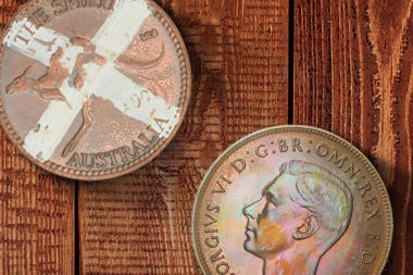 Two pennies similar to those used in two-up on floorboards (digital image)
