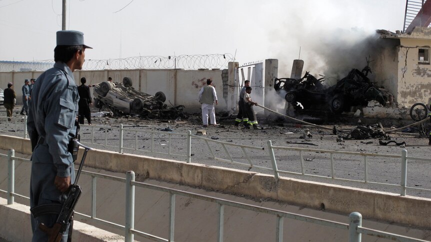 Firefighters at the scene of an Afghanistan car bomb