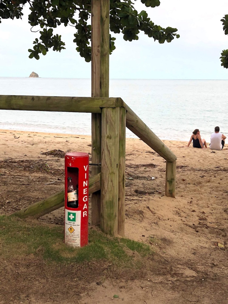 A generic image of the beach with a vinegar station.