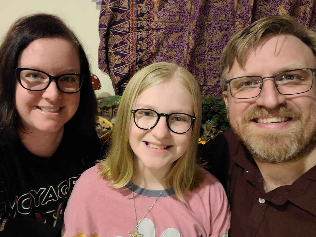 A selfie of Becca Chapman on the left, her daughter in the middle and husband on the far right 