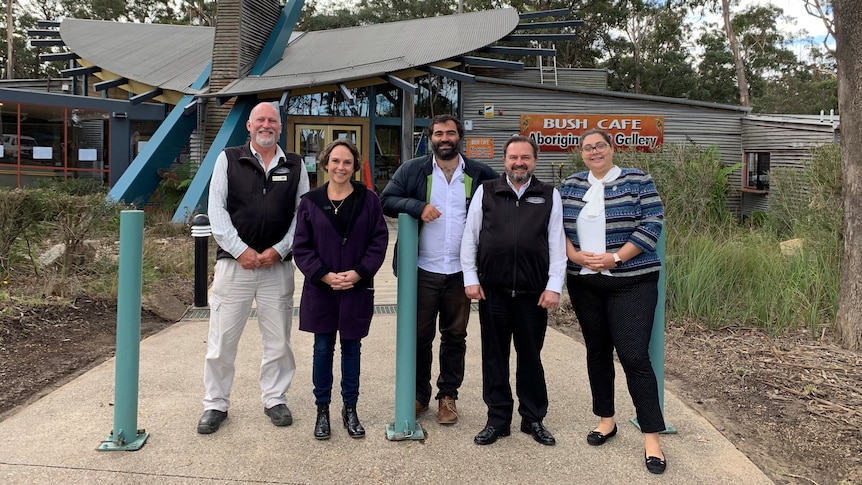 Three men and two women standing outside a cafe in East Gippsland