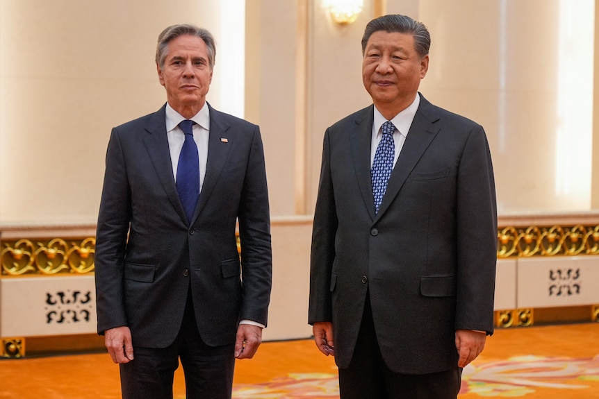 US Secretary of State standing next to the Chinese president.